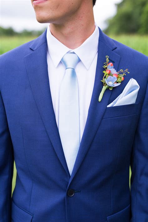 navy blue suit light tie.